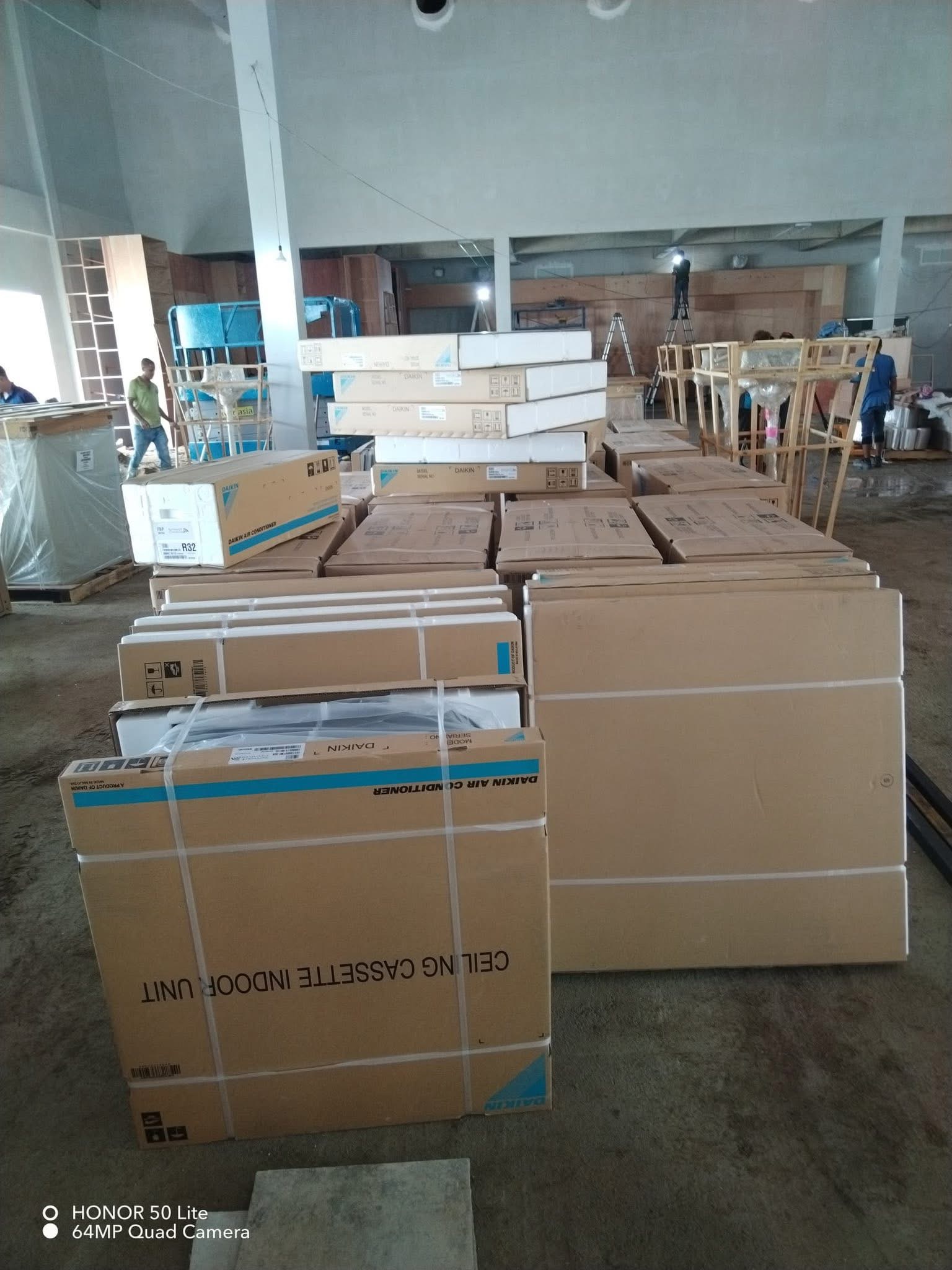 Daikin ceiling cassette units staged for installation at a large commercial development